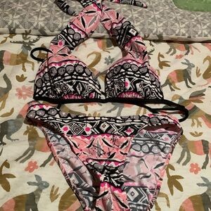 Women’s two-piece swimsuit by Venus top is padded. Very gently used.